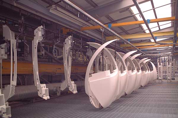 Injection Mouldings on a MCM Powertrack 60 Conveyor